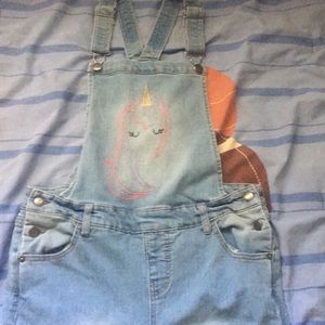 Unicorn blue jean overalls .
